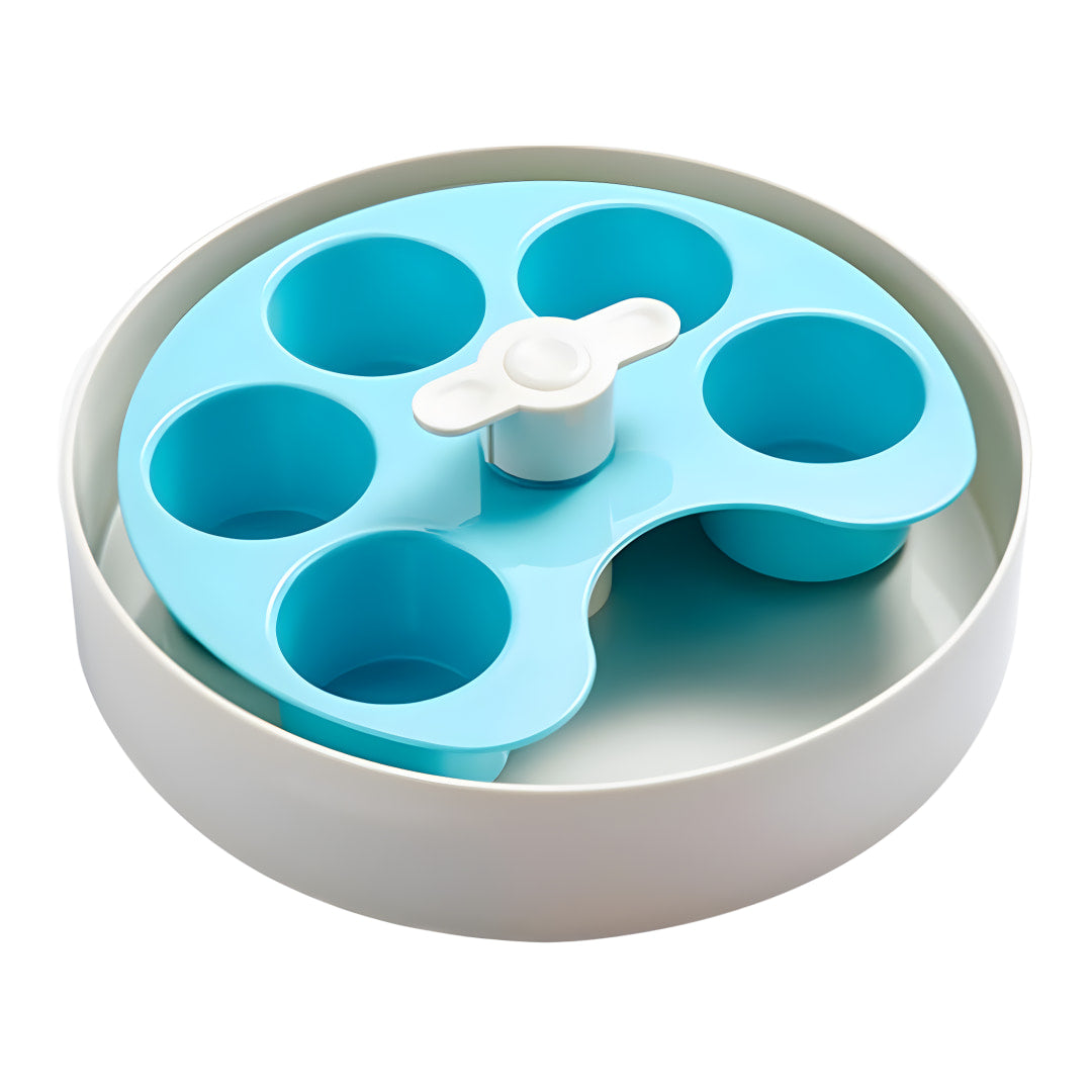Empty spin bowl with a light blue, 5-well palette nested in a larger white bowl.