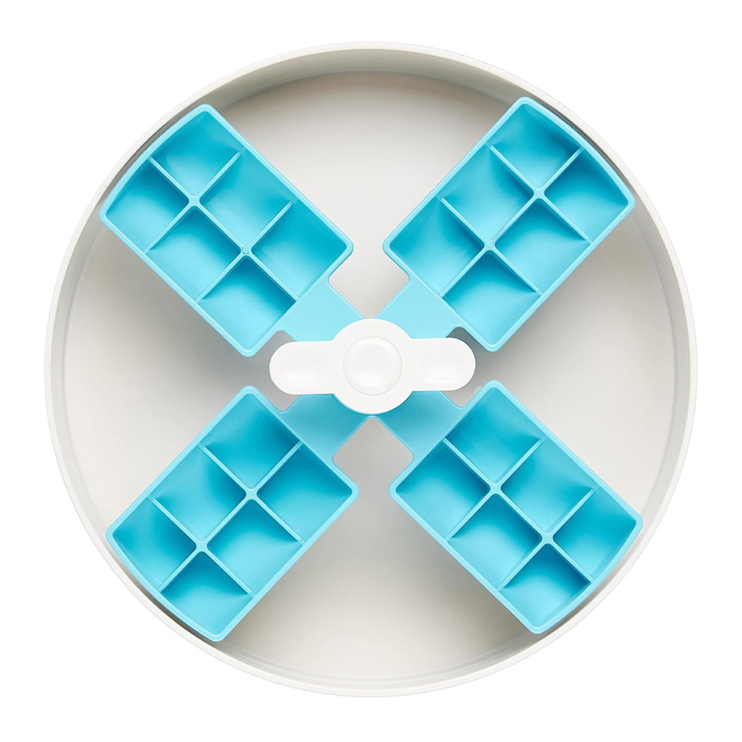 Empty spin bowl with a light blue, windmill-like inner section nested into a bigger white bowl.